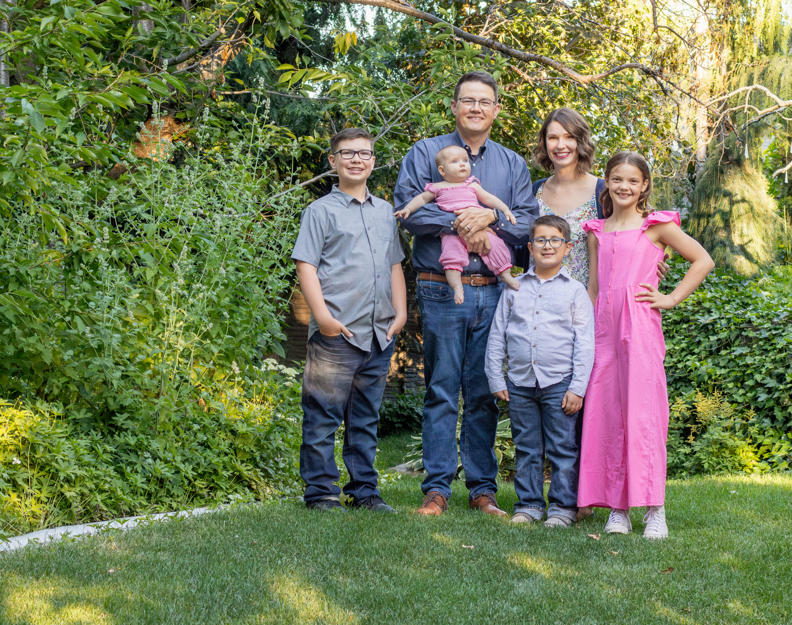 Chris Corry with his family in their grass garden