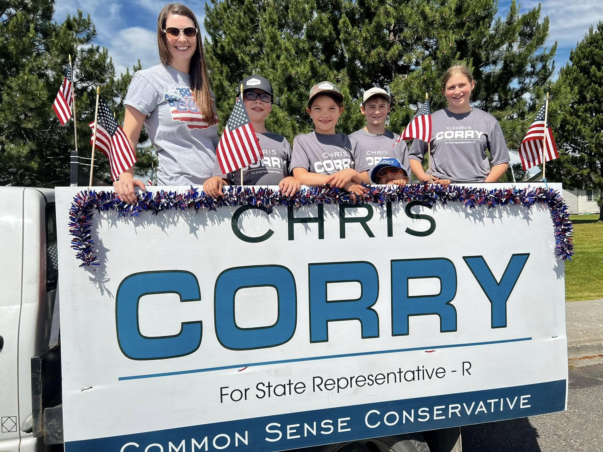 Campaign parade float with a large Chris Corry sign