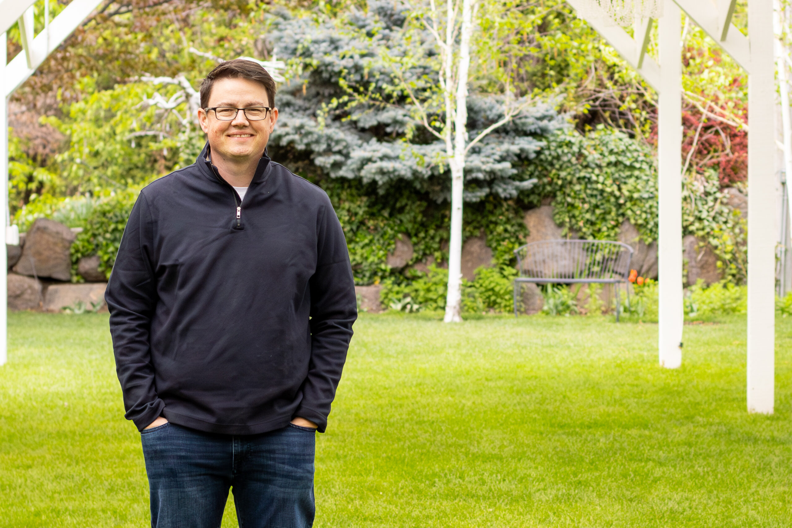 Casual portrait of Chris Corry in a gray quarter-zip